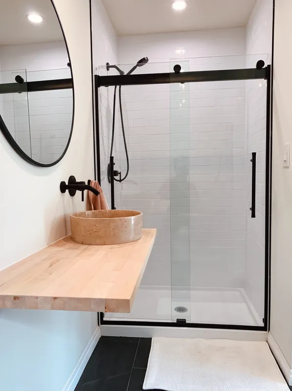 Finished bathroom renovation with glass shower and vanity in Pasadena